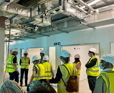 Eddie with local residents on tour of the site